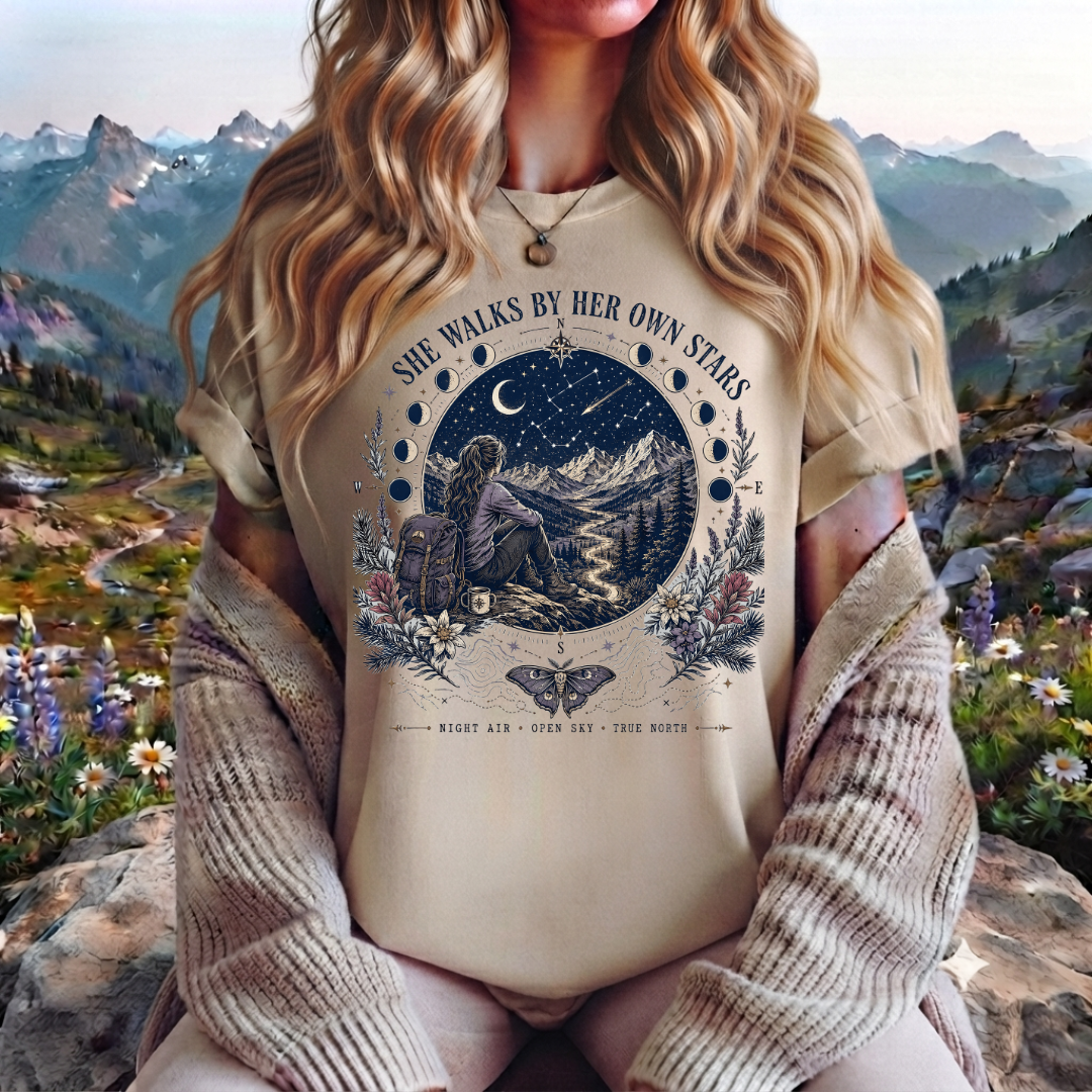 She Walks By Her Own Stars T-Shirt — Night Sky Adventure Graphic Tee